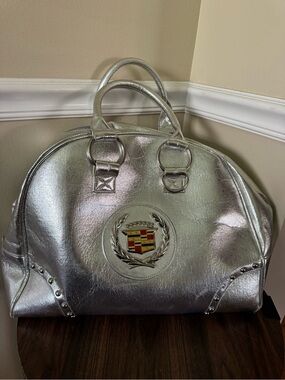 Emblem Metallic Silver Satchel Bag